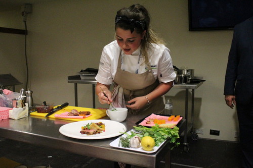 April Partridge carefully dressing her dish at The Show